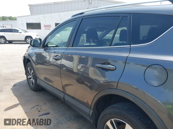 2018 Toyota RAV4 XLE with VIN JTMWFREV9JJ201845, listed as a IAAI auction lot 42442303 with 111,177 mi miles and . Bid and sale history available at DreamBid. Image 14.