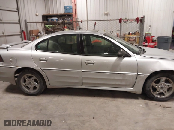2003 Pontiac Grand Am GT with VIN 1G2NW52E93M605453, listed as a IAAI auction lot 41546839 with 202,918 mi miles. Bid and sale history available at carsss.com. Image 13.