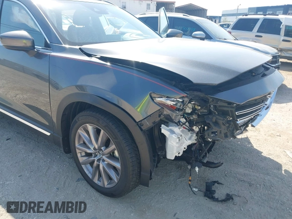 2020 Mazda CX-9 Grand Touring z VIN JM3TCADY8L0417775, wystawiony jako IAAI lot #42306864 z przebiegiem 35 287 mil mil oraz . Historia ofert i sprzedaży dostępna na DreamBid. Obrazek 6.