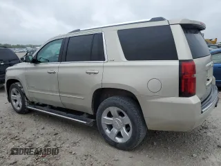 2015 Chevrolet Tahoe LTZ z VIN 1GNSKCKC5FR100084, wystawiony jako Copart lot #57677825 z przebiegiem 141 987 mil mil oraz Czysty tytuł • Clean title. Historia ofert i sprzedaży dostępna na DreamBid. Obrazek 2.