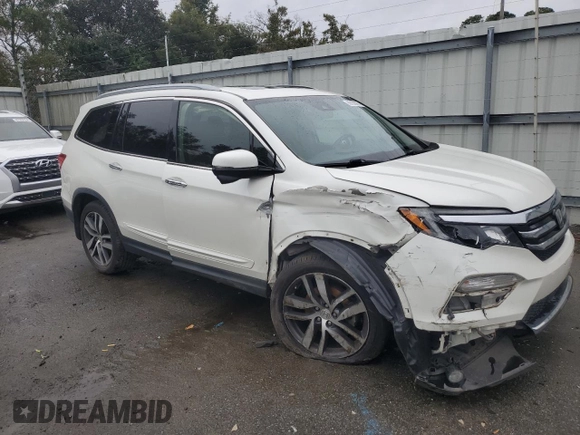 2017 Honda Pilot Touring with VIN 5FNYF6H99HB025600, listed as a Copart auction lot 88131475 with 131,939 mi miles and Salvage Title. Bid and sale history available at DreamBid. Image 4.