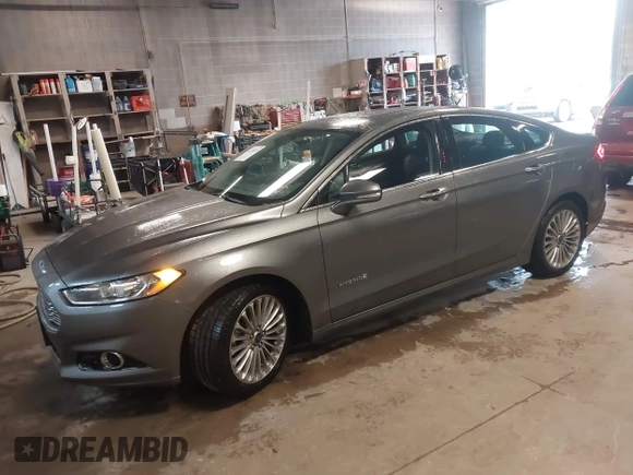 2013 Ford Fusion Titanium Hybrid with VIN 3FA6P0RU6DR319586, listed as a IAAI auction lot 42138979 with 125,388 mi miles. Bid and sale history available at carsss.com. Image 2.