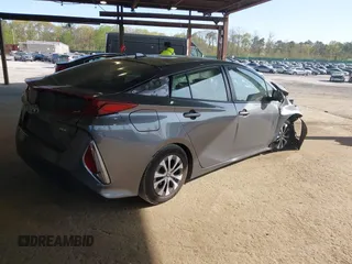 2021 Toyota Prius LE with VIN JTDKAMFP2M3168342, listed as a IAAI auction lot 42132946 with 69,628 mi miles and . Bid and sale history available at DreamBid. Image 4.