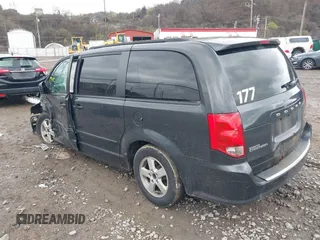2012 Dodge Grand Caravan SXT with VIN 2C4RDGCG8CR242235, listed as a IAAI auction lot 41922083 with 124,306 mi miles and . Bid and sale history available at DreamBid. Image 3.