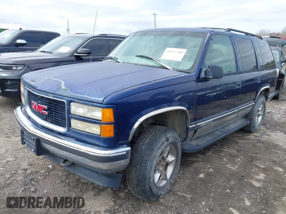 1997 GMC Yukon with VIN 1GKEK13R6VJ715421, listed as a IAAI auction lot 41811398 with 214,735 mi miles. Bid and sale history available at carsss.com. Image 2.