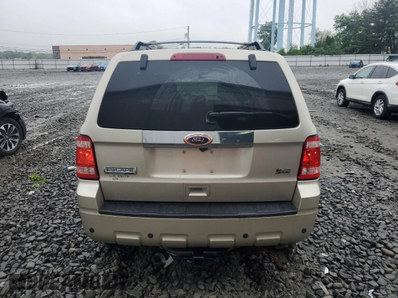 2010 Ford Escape Limited with VIN 1FMCU0EGXAKA03092, listed as a Copart auction lot 61094785 with 114,884 mi miles and Salvage title. Bid and sale history available at DreamBid. Image 6.