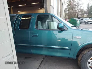1997 Ford F-150 XL with VIN 1FTEX18L1VKB44867, listed as a IAAI auction lot 41266572 with 105,061 mi miles. Bid and sale history available at carsss.com. Image 13.