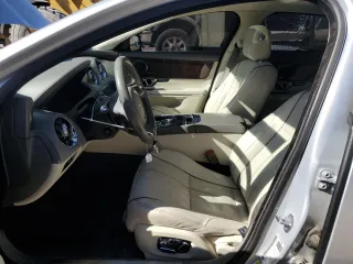 2014 Jaguar XJ Portfolio with VIN SAJWA2GZ2E8V70065, listed as a Copart auction lot 43872505 with 138,677 mi miles and Salvage title. Bid and sale history available at DreamBid. Image 7.