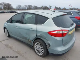 2013 Ford C-Max Hybrid SEL with VIN 1FADP5BU8DL523402, listed as a IAAI auction lot 41676386 with 214,649 mi miles. Bid and sale history available at carsss.com. Image 3.