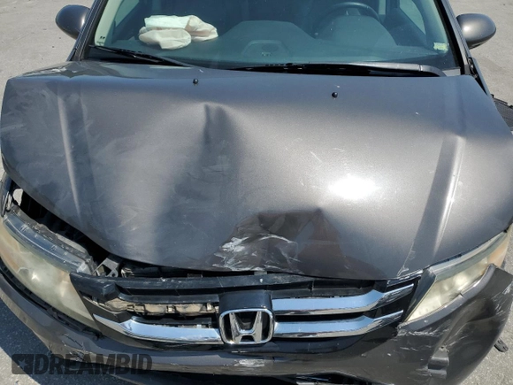 2014 Honda Odyssey Touring with VIN 5FNRL5H93EB061754, listed as a Copart auction lot 55182015 with 168,058 mi miles and Salvage title. Bid and sale history available at DreamBid. Image 12.