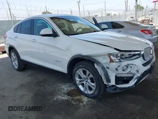 2015 BMW X4 xDrive28i with VIN 5UXXW3C5XF0M89259, listed as a IAAI auction lot 42553903 with 98,960 mi miles and . Bid and sale history available at DreamBid. Image 1.