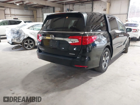 2018 Honda Odyssey Touring with VIN 5FNRL6H87JB105410, listed as a IAAI auction lot 41860707 with 91,908 mi miles. Bid and sale history available at carsss.com. Image 4.