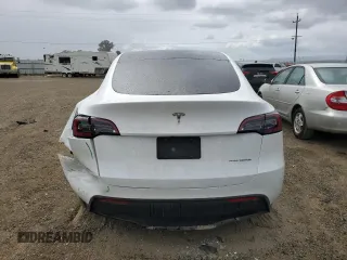 2023 Tesla Model Y Long Range z VIN 7SAYGAEE0PF693613, wystawiony jako Copart lot #54452895 z przebiegiem 19 574 mil mil oraz Szkoda całkowita • Salvage title. Historia ofert i sprzedaży dostępna na DreamBid. Obrazek 6.