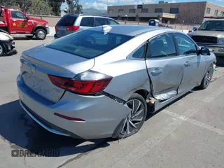 2019 Honda Insight Touring with VIN 19XZE4F93KE007489, listed as a IAAI auction lot 41943334 with 118,689 mi miles and . Bid and sale history available at DreamBid. Image 4.