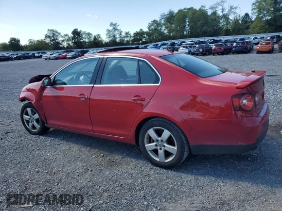 2009 Volkswagen Jetta SE with VIN 3VWRZ71K69M177746, listed as a Copart auction lot 70990074 with 128,390 mi miles and Salvage title. Bid and sale history available at DreamBid. Image 2.