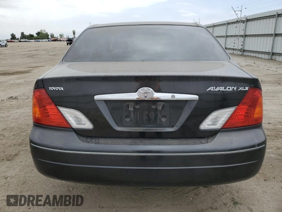 2000 Toyota Avalon XL with VIN 4T1BF28B4YU105732, listed as a Copart auction lot 54752665 with 143,855 mi miles and Salvage Title. Bid and sale history available at DreamBid. Image 6.