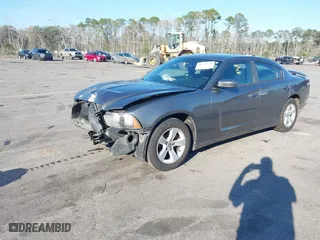 2011 Dodge Charger SE with VIN 2B3CL3CGXBH544312, listed as a IAAI auction lot 41675770 with 209,438 mi miles. Bid and sale history available at carsss.com. Image 2.