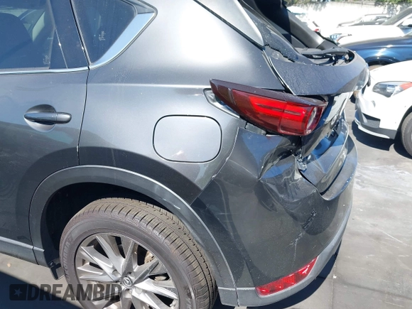 2020 Mazda CX-5 Grand Touring with VIN JM3KFADM3L1812649, listed as a IAAI auction lot 42575393 with 102,118 mi miles and . Bid and sale history available at DreamBid. Image 12.