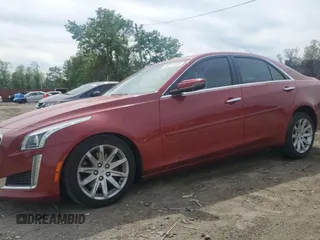 2014 Cadillac CTS Luxury AWD with VIN 1G6AX5SX0E0154757, listed as a Copart auction lot 56317425 with 156,719 mi miles and Salvage title. Bid and sale history available at DreamBid. Image 1.