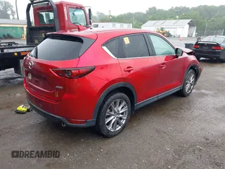 2019 Mazda CX-5 Grand Touring with VIN JM3KFBDM8K0693622, listed as a IAAI auction lot 42503818 with 60,812 mi miles and . Bid and sale history available at DreamBid. Image 4.