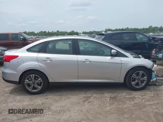 2018 Ford Focus SE z VIN 1FADP3FE4JL214013, wystawiony jako IAAI lot #42180138 z przebiegiem 72 550 mil mil oraz . Historia ofert i sprzedaży dostępna na DreamBid. Obrazek 13.