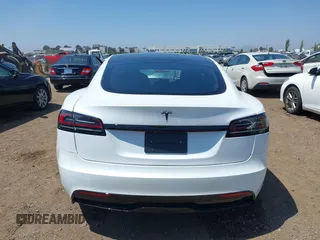 2023 Tesla Model S with VIN 5YJSA1E51PF499919, listed as a IAAI auction lot 42459166 with 6,612 mi miles and . Bid and sale history available at DreamBid. Image 17.