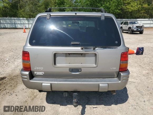 1998 Jeep Grand Cherokee Limited with VIN 1J4GZ78YXWC160346, listed as a Copart auction lot 52595655 with Not provided miles and Salvage title. Bid and sale history available at DreamBid. Image 6.