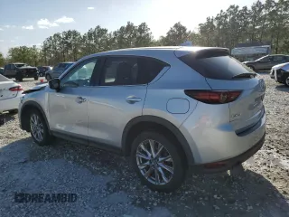 2021 Mazda CX-5 Grand Touring with VIN JM3KFADM8M1339008, listed as a Copart auction lot 49150115 with 144,851 mi miles and Salvage Title. Bid and sale history available at carsss.com. Image 2.