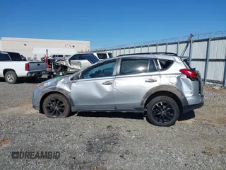 2018 Toyota RAV4 XLE with VIN 2T3RFREVXJW748993, listed as a IAAI auction lot 41878888 with 111,760 mi miles and . Bid and sale history available at DreamBid. Image 14.