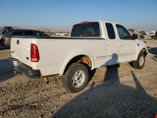 1998 Ford F-150 z VIN 1FTZX18W3WKB01774, wystawiony jako Copart lot #88670315 z przebiegiem 102 301 mil mil oraz Szkoda całkowita • Salvage title. Historia ofert i sprzedaży dostępna na DreamBid. Obrazek 3.