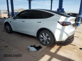 2022 Tesla Model Y Long Range z VIN 7SAYGDEE5NA015841, wystawiony jako Copart lot #57842275 z przebiegiem 51 952 mil mil oraz Szkody całkowita. Historia ofert i sprzedaży dostępna na DreamBid. Obrazek 2.