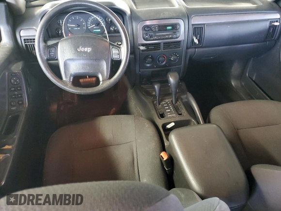 2003 Jeep Grand Cherokee Laredo with VIN 1J4GW48S43C567559, listed as a Copart auction lot 61431595 with 249,998 mi miles and Salvage title. Bid and sale history available at DreamBid. Image 8.