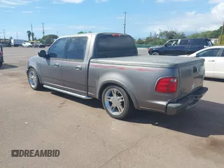 2002 Ford F-150 Harley Davidson with VIN 1FTRW07312KC88379, listed as a IAAI auction lot 41657219 with 1 mi miles. Bid and sale history available at carsss.com. Image 3.