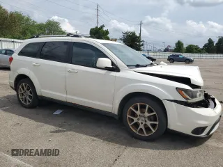 2012 Dodge Journey SXT with VIN 3C4PDCCG4CT243492, listed as a Copart auction lot 59908485 with 319,175 mi miles and Salvage title. Bid and sale history available at DreamBid. Image 4.