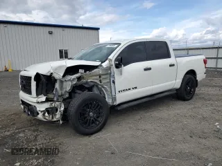 2018 Nissan Titan S with VIN 1N6AA1E55JN543681, listed as a Copart auction lot 57069605 with 59,287 mi miles and Salvage title. Bid and sale history available at DreamBid. Image 1.