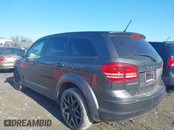 2015 Dodge Journey SE z VIN 3C4PDCAB4FT675074, wystawiony jako IAAI lot #42059878 z przebiegiem 99 947 mil mil oraz . Historia ofert i sprzedaży dostępna na DreamBid. Obrazek 3.