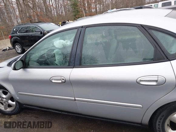 2003 Ford Taurus SE Standard with VIN 1FAFP53273G132268, listed as a IAAI auction lot 41790335 with 202,724 mi miles. Bid and sale history available at carsss.com. Image 14.