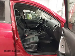 2016 Mazda CX-5 Grand Touring with VIN JM3KE4DY7G0731057, listed as a IAAI auction lot 41118072 with 134,107 mi miles and . Bid and sale history available at carsss.com. Image 5.