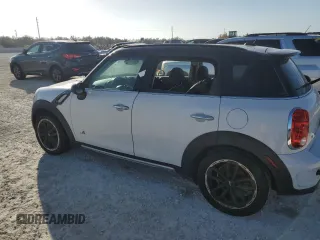 2016 MINI Countryman S with VIN WMWZC5C51GWU01290, listed as a Copart auction lot 77684384 with 106,811 mi miles and Salvage Title. Bid and sale history available at DreamBid. Image 2.