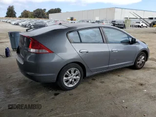 2011 Honda Insight EX with VIN JHMZE2H77BS006079, listed as a Copart auction lot 63873985 with 134,159 mi miles and Salvage title. Bid and sale history available at DreamBid. Image 3.