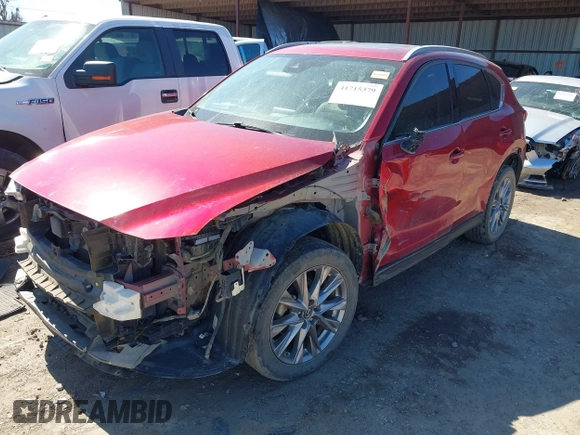 2020 Mazda CX-5 Grand Touring with VIN JM3KFADM3L0761286, listed as a IAAI auction lot 41715379 with 145,656 mi miles and . Bid and sale history available at DreamBid. Image 2.