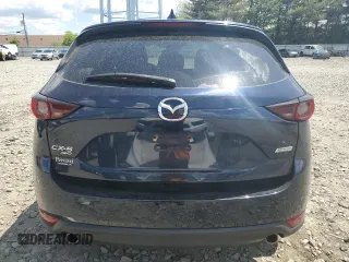 2018 Mazda CX-5 Touring with VIN JM3KFBCMXJ0460020, listed as a Copart auction lot 55997305 with 56,361 mi miles and Salvage Title. Bid and sale history available at DreamBid. Image 6.