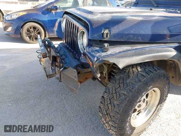 1997 Jeep Wrangler Sport with VIN 1J4FY19S1VP462136, listed as a IAAI auction lot 41766868 with 130,980 mi miles. Bid and sale history available at carsss.com. Image 6.