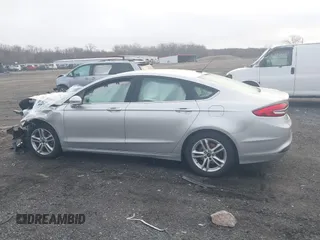 2018 Ford Fusion SE z VIN 3FA6P0HD2JR207865, wystawiony jako IAAI lot #41835895 z przebiegiem 91 069 mil mil oraz . Historia ofert i sprzedaży dostępna na DreamBid. Obrazek 14.