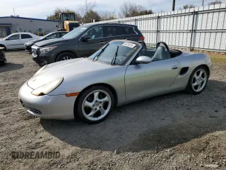 1999 Porsche Boxster z VIN WP0CA2985XU628802, wystawiony jako Copart lot #48570315 z przebiegiem 98 517 mil mil oraz Czysty tytuł • Clean title. Historia ofert i sprzedaży dostępna na DreamBid. Obrazek 1.