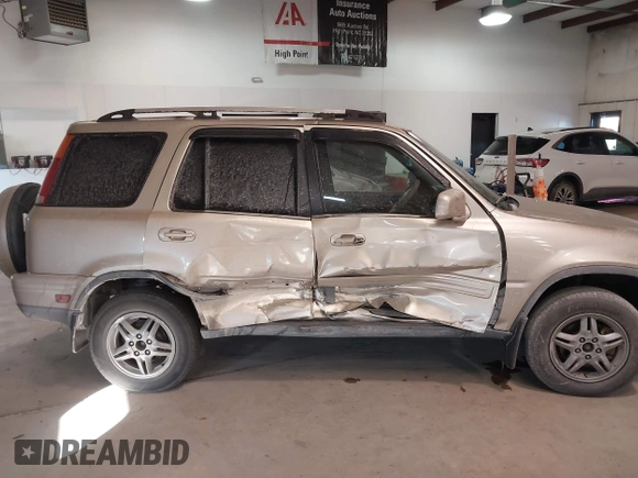 2000 Honda CR-V SE with VIN JHLRD1879YC037127, listed as a IAAI auction lot 41285624 with 246,170 mi miles. Bid and sale history available at carsss.com. Image 13.