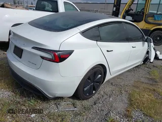 2024 Tesla Model 3 Long Range with VIN 5YJ3E1EB7RF854092, listed as a IAAI auction lot 41697646 with 7,371 mi miles and . Bid and sale history available at DreamBid. Image 4.