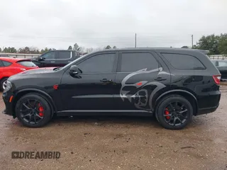 2023 Dodge Durango SRT Hellcat Premium with VIN 1C4SDJH99PC584770, listed as a IAAI auction lot 41562157 with 14,598 mi miles and . Bid and sale history available at DreamBid. Image 14.