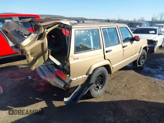 1999 Jeep Cherokee Sport with VIN 1J4FT68S7XL589206, listed as a IAAI auction lot 41411949 with 143,158 mi miles and . Bid and sale history available at DreamBid. Image 4.