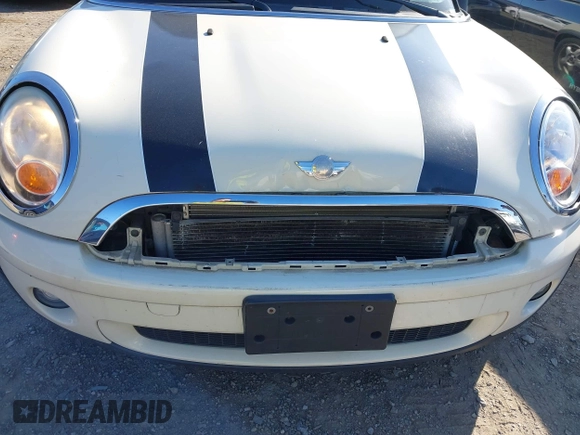 2007 MINI Hardtop with VIN WMWMF33597TU61986, listed as a IAAI auction lot 42139746 with 92,448 mi miles and . Bid and sale history available at DreamBid. Image 6.